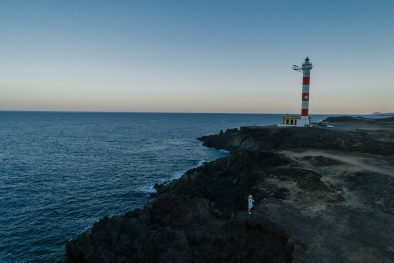 Photo by Mikhail Nilov: https://www.pexels.com/photo/lighthouse-on-a-coastal-area-8413110/